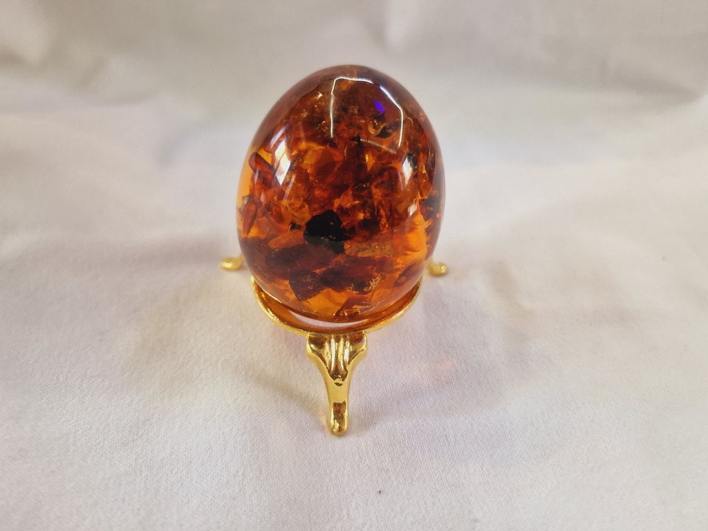 russian pressed amber egg on stand 73 .3 g